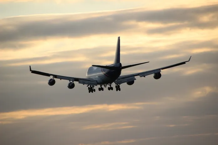 Airplane in evening sky