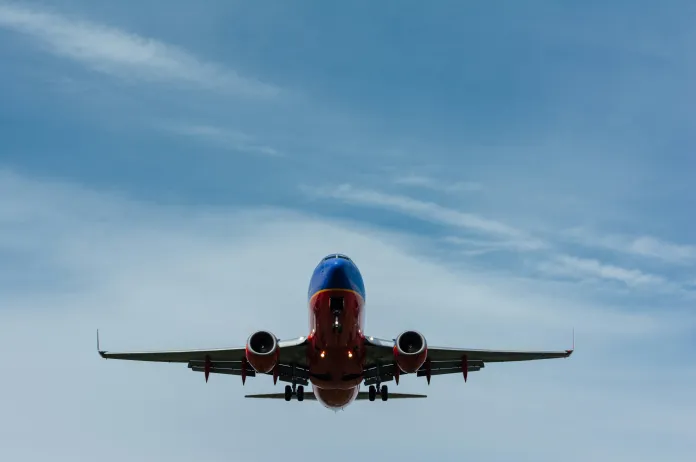 Under airplane flying in air
