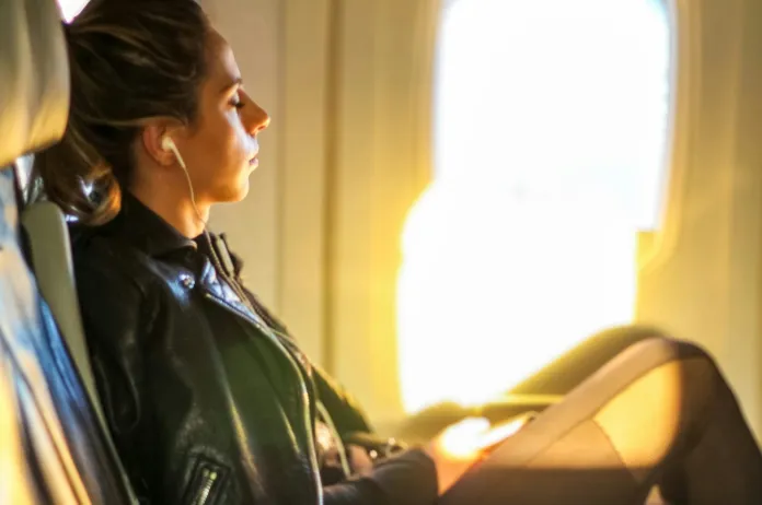 Headphones on plane scaled e1772869258210