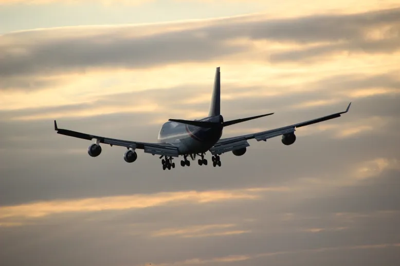 Airplane in evening sky