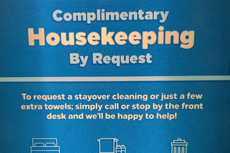 Complimentary Housekeeping By Request sign