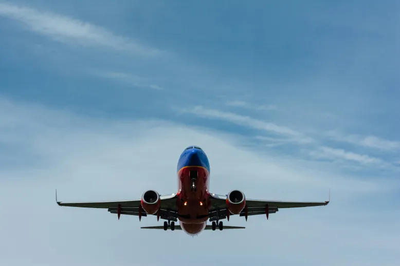 Under airplane flying in air