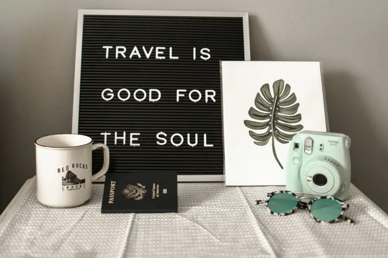 "Travel is good for the soul" sign