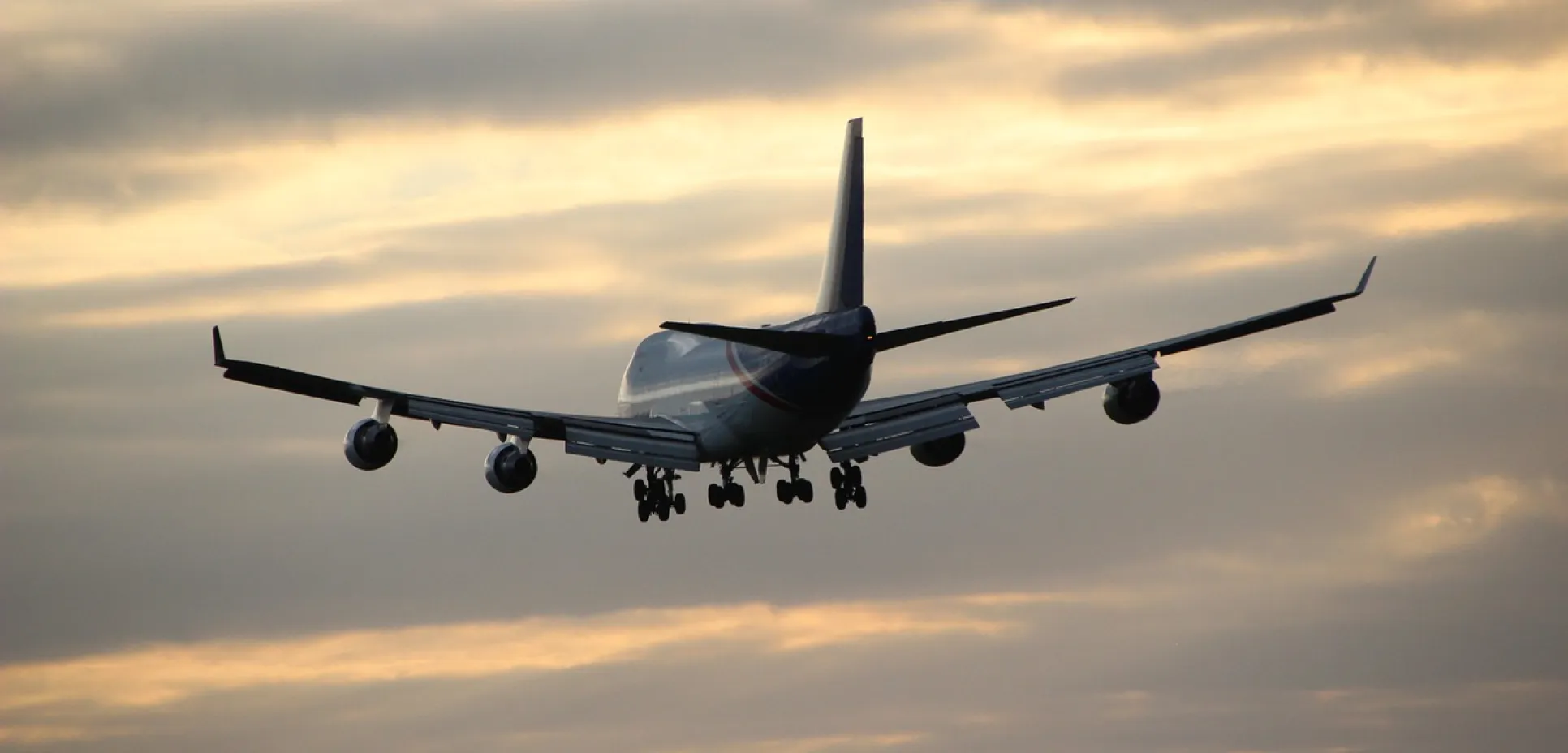 Airplane in evening sky