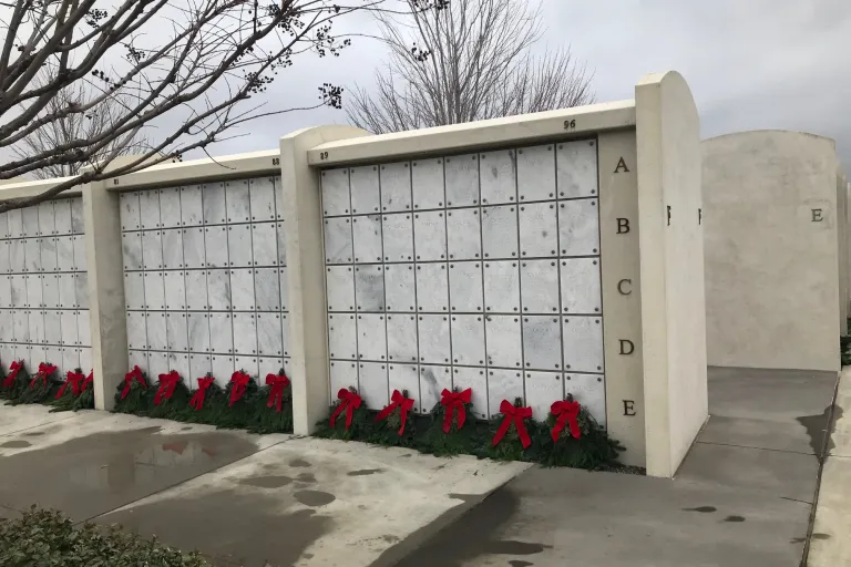 War memorial with names engraved and wreaths