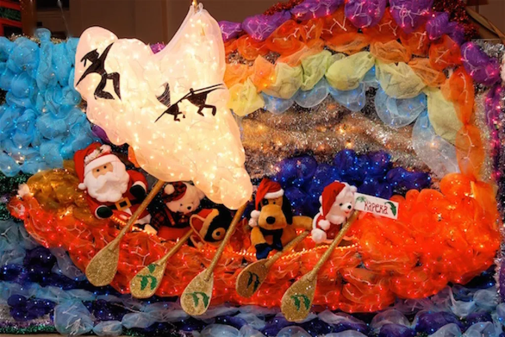 Santa arriving in an outrigger canoe