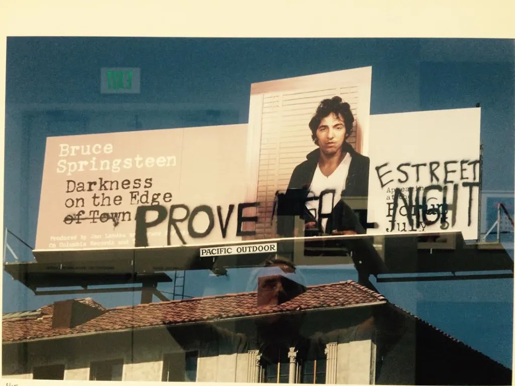 Billboard defaced by bruce springsteen and his band